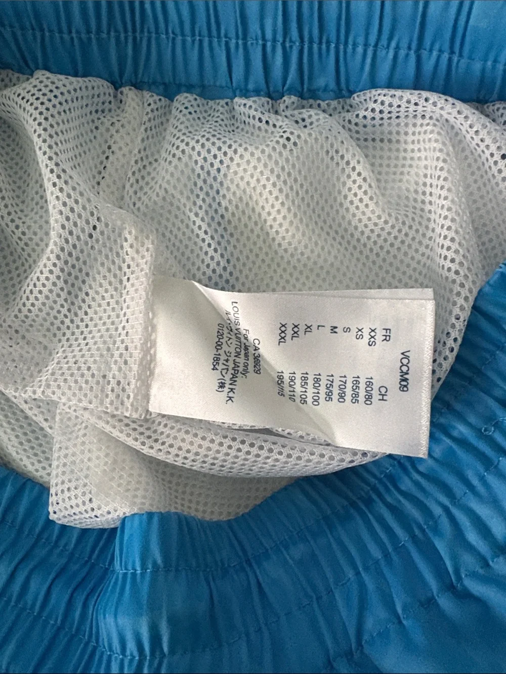 Louis Vuitton Men’s Sky Blue Monogram Swim Trunks with White Graphic